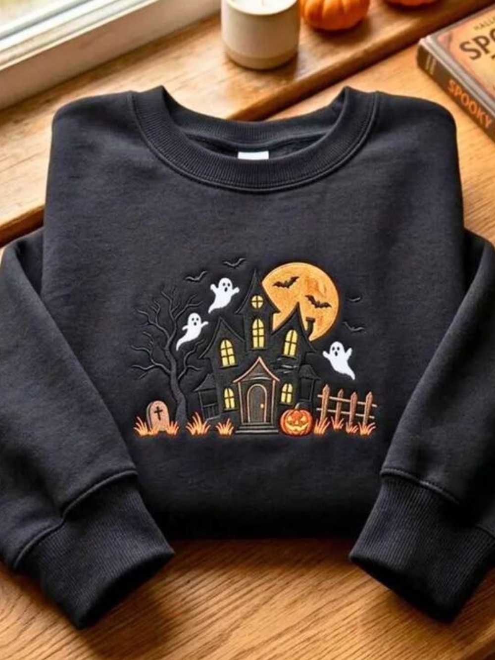 Women's Black Crewneck Sweatshirt with Halloween Haunted House Graphic